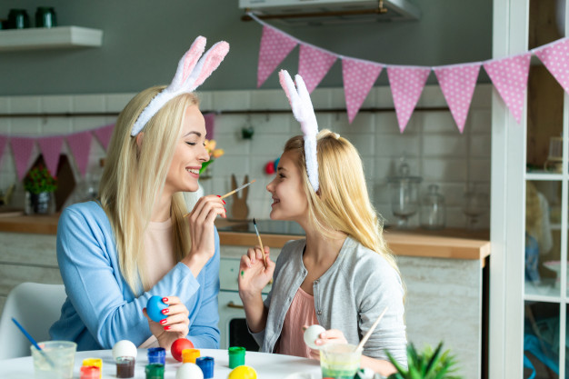 funny mother daughter painting easter